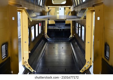 Inside Of The Rail Car Assembly Plant. Industrial Workshop For Production Of High Speed Trains. Factory Of Manufacturing Trainsets Passenger Rolling Stock. Painting A Body Train Car In Paint Shop.