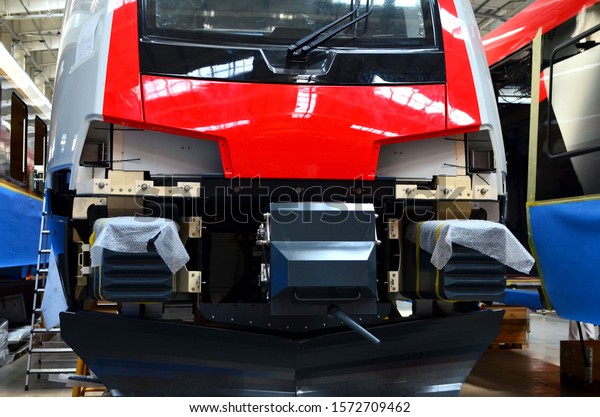 Inside of the rail car assembly\
plant. Industrial workshop for the production of high speed trains.\
Factory of the manufacturing trainsets rolling stock\
