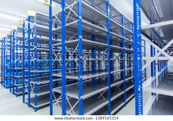 Inside the\
spare room With shelves prepared for storing auto spare parts,\
spare room, Factory warehouse spare\
parts.