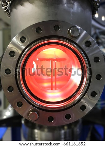 Inside vacuum chamber doing the sputtering to fabricate thin film technology.