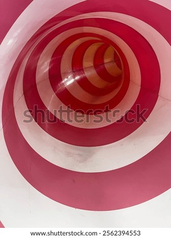 Inside View of a Bright Pink and White Tunnel Slide at Playground 