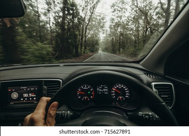 Inside View Of Car Steering Wheel While Driving Across Australian Road