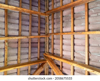 Inside View Of Ceramic Tiled Roof With Wooden Rafters