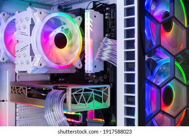 Inside View Of Custom Colorful Illuminated Bright Rainbow RGB LED Gaming Pc.. Computer Power Hardware And Technology Concept Background