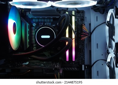 Inside View Of Custom Colorful Illuminated Bright Rainbow RGB LED Gaming Pc.. Computer Power Hardware And Technology Concept Background