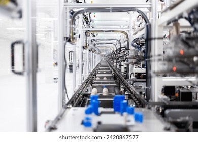 Inside view of high tech automated industrial machine producing electronics components.