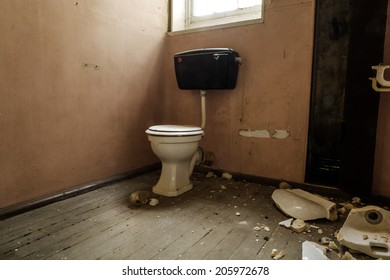inside view of an old building with a broken loo - Shutterstock ID 205972678
