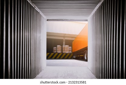 Inside View Of Shipping Cargo Container. Trailer Trucks Loading Packaging Boxes At Dock Warehouse. Shipping Freight Trucks Transport Logistics.