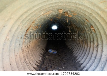 Inside view of Small culvert under a farm to market road in Texas