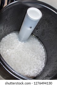 Inside view of water softener brine tank with salt pellets
