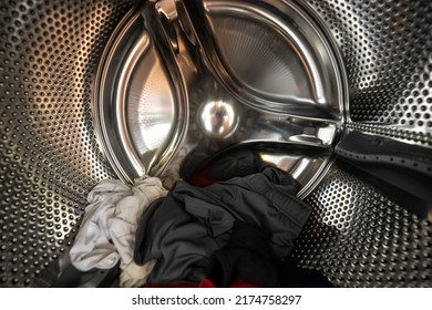 Inside of a Washing Machine with Clothes - Powered by Shutterstock