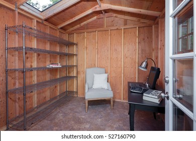 Inside Of A Wooden Garden Shed Used As Home Office.