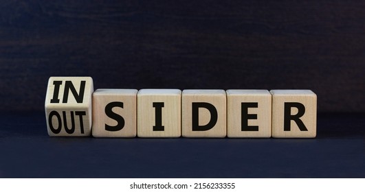 Insider Or Outsider Symbol. Turned Wooden Cubes And Changed The Concept Word Insider To Outsider. Beautiful Black Table Black Background. Business Insider Or Outsider Concept. Copy Space.