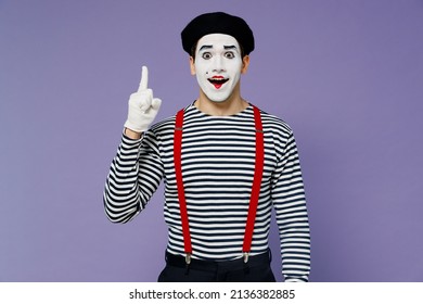 Insighted Smart Proactive Fun Young Mime Man With White Face Mask Wears Striped Shirt Beret Holding Index Finger Up With Great New Idea Isolated On Plain Pastel Light Violet Background Studio Portrait