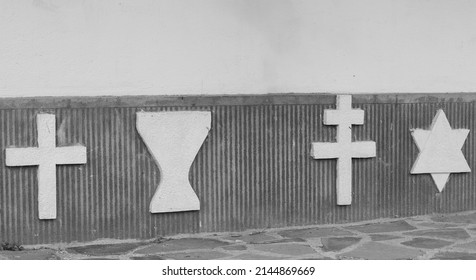 The Insignia Of Several Religious Denominations On A Wall