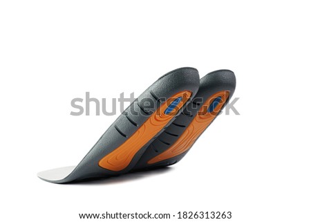 Insoles isolated on a white background. Soft foam insoles with silicone inserts bottom view.
