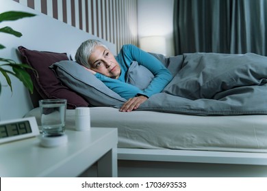 Insomnia - Sleep Disorder. Worried Senior Woman Suffering From Insomnia, Lying In Bed, Staying Awake Late At Night 