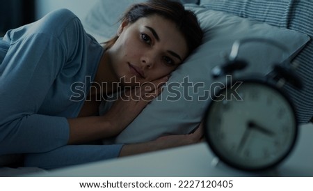  Insomniac young woman in bed
