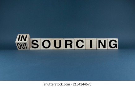 Insourcing or outsourcing. Cubes form words Insourcing or Outsourcing. Business concept