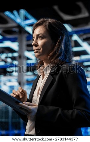 Inspecting infrastructure, tablet and software developer in data center, updating rackmounts network systems. Overseeing equipment rigs, device and IT expert ensuring stable server room operations