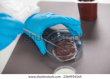 Inspecting pudding samples for  quality control in a laboratory  