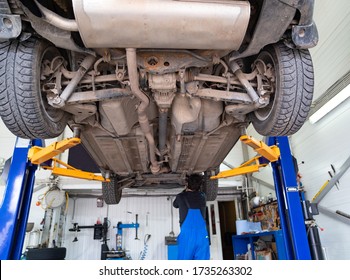 Inspection Of The Undercarriage Of The Car In The Garage. Repair And Maintenance Of The Car In Service.