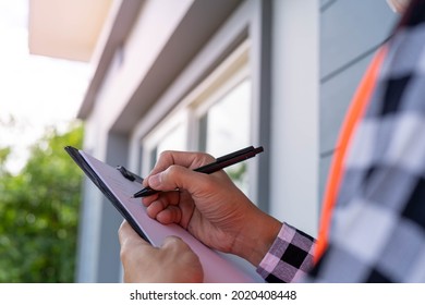 Inspector or engineer is checking and inspecting the building or house by using checklist. Engineers and architects work on building the house before handing it over to the landlord.