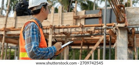 inspector or engineer is inspecting construction and quality assurance new house using a checklist. Engineers or architects or contactor work to build the house before handing it over to the homeowner