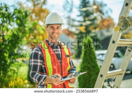 The inspector or engineer with ladder checking the building structure and house roof specifications.