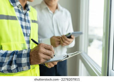 inspector engineer and owner project is inspecting construction and quality assurance new house. Engineers or architects or contactor work to build the house before handing it over to the homeowner - Shutterstock ID 2278207811