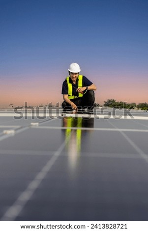 Inspector examination of photovoltaic modules using a thermal imaging camera. Engineer Checking Temperature the string cables input to inverter solar panel used thermos infrared. 