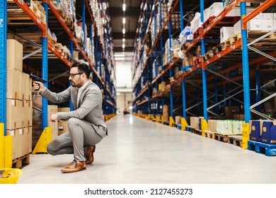 An Inspector Using Qr And Bar Code Scanner To Check On Order At Storage.