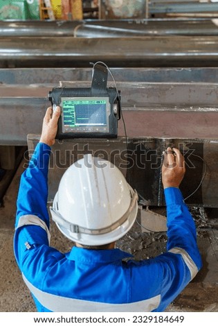 Inspectors are Inspection defects in Welded Steel H-beam add joints with Process Ultrasonic Testing (UT) of Non-Destructive Testing (NDT)