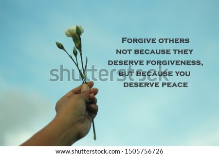 Inspiraitonal motivational quote-Forgive others not because they deserve forgiveness, but because you deserve peace. With young plant in hand on blue sky background.