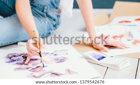 Inspiration and art talent. Painting hobby. Woman painting beautiful floral artwork. Creative design.