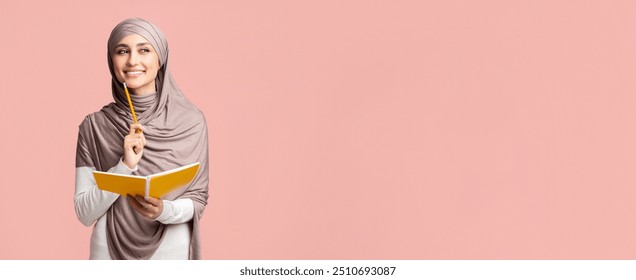 Inspiration concept. Thoughtful smiling muslim girl in hijab holding notebook and pencil, thinking about plan or checklist - Powered by Shutterstock