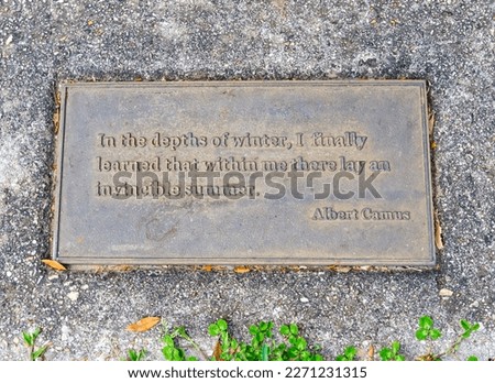 Inspiration quotation of noted philosopher, Albert Camus, on a sidewalk plaque