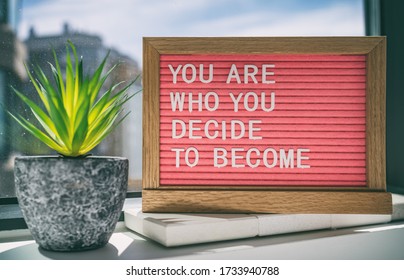 Inspiration quote message sign saying You are who you decide to become - life advice for self esteem, confidence. Home background. - Shutterstock ID 1733940788