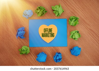 Inspiration Showing Sign Offline Marketing. Internet Concept Advertising Strategy Published Outside Of The Internet Colorful Crumpled Papers Circular Pattern Surrounding Heart Shaped Card.