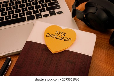Inspiration showing sign Open Enrollment. Word Written on The yearly period when showing can enroll an insurance Blank Notepad Laptop With Pen And Headphones Beside Cup Of Warm Coffee. - Shutterstock ID 2093861965