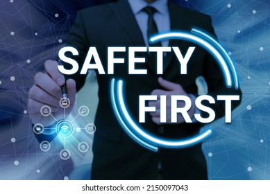 Inspiration Showing Sign Safety First. Business Approach Avoid Any Unnecessary Risk Live Safely Be Careful Pay Attention Man Holding Screen Of Mobile Phone Showing The Futuristic Technology.