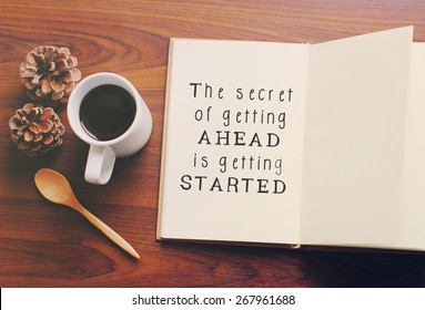 Inspirational motivating quote on notebook and coffee with retro filter effect - Shutterstock ID 267961688