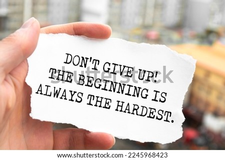 Inspirational motivational quote 'Don't give up! The beginning is always the hardest'.