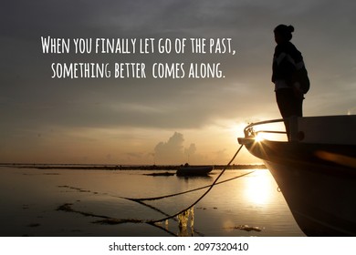 Inspirational motivational quote - When you finally go of the past, something better comes along. With silhouette of young woman standing alone in a boat in the beach. Positive self love care concept. - Powered by Shutterstock