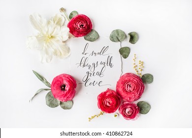 inspirational quote "Do small things with great love" written in calligraphy style on paper with pink, red roses, ranunculus, white tulip and leaves isolated on white background. Flat lay, top view - Powered by Shutterstock