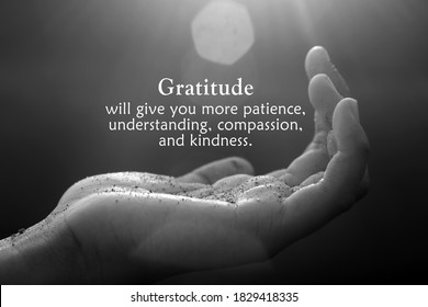 Inspirational Quote - Gratitude Will Give You More Patience, Understanding, Compassion, And Kindness. With Open Palm Hand Receiving The Light Concept On Black And White Abstract Art Background.