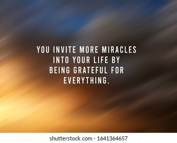 Inspirational quote - You invite more miracles into your life by being grateful for everything. On blurry  digital motion background of sunset sunrise light. Miracle and gratefulness concept.