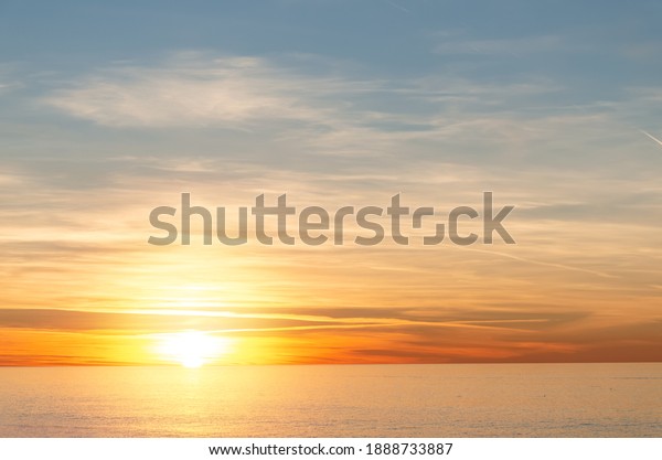 Inspirational tranquil sea with sunset\
sky. Colorful horizon over the calm water. Batumi, Georgia.\
