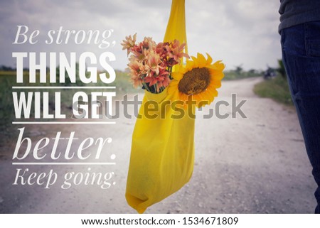 Inspirational words - Be strong. Things will get better. Keep going. Young man or woman with bouquet of flowers in yellow eco bag on natural light  in the rural white  coral road view background. Stock photo © 