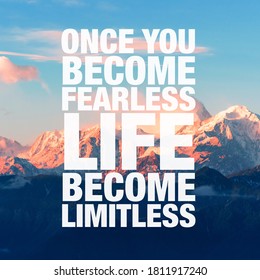Inspirational words “Once you become fearless life become limitless” written on sunset mountains background. Motivational typography.